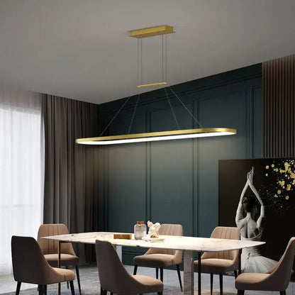 Gold rectangular pendant light with sleek modern design hanging above dining table decorbites led chandelier pendant