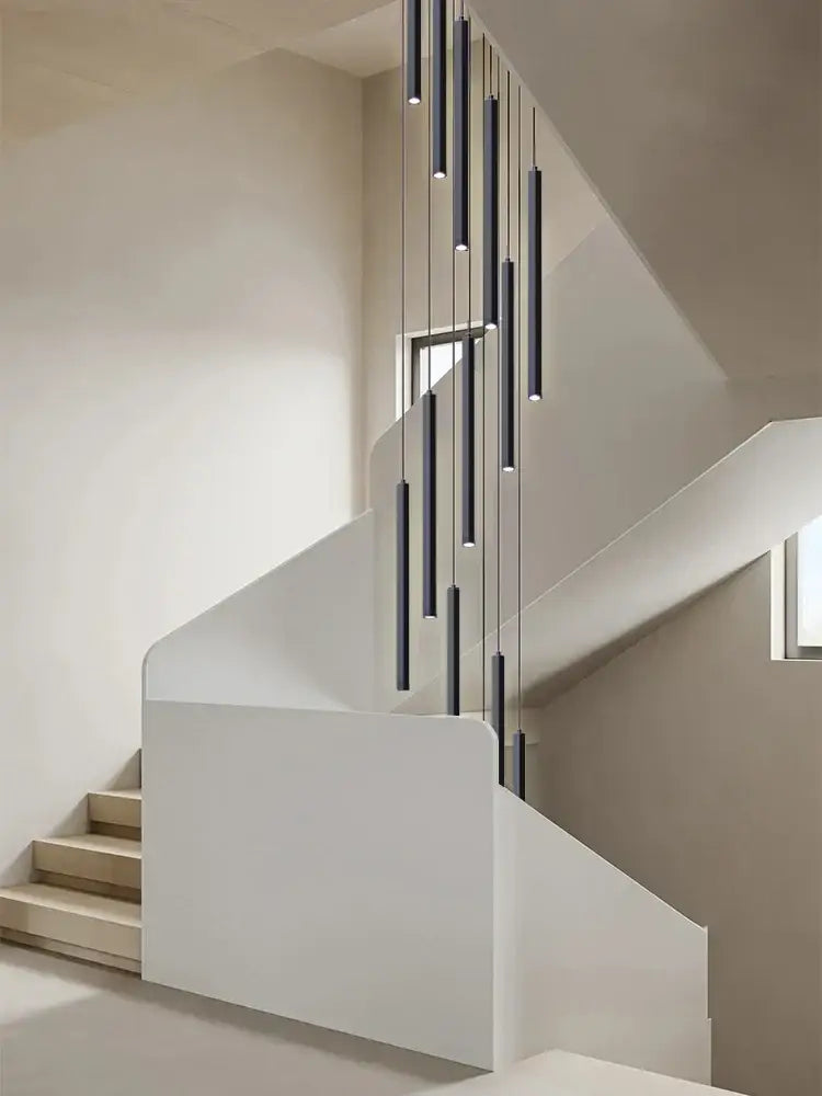 Modern black cylindrical decorbites led chandelier stairs pendant lights hanging above a staircase for hotel lobby decor