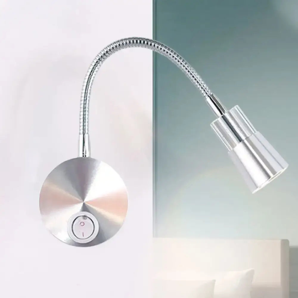 Silver metallic gooseneck reading lamp with flexible arm and mini metal shade ideal for bedroom use
