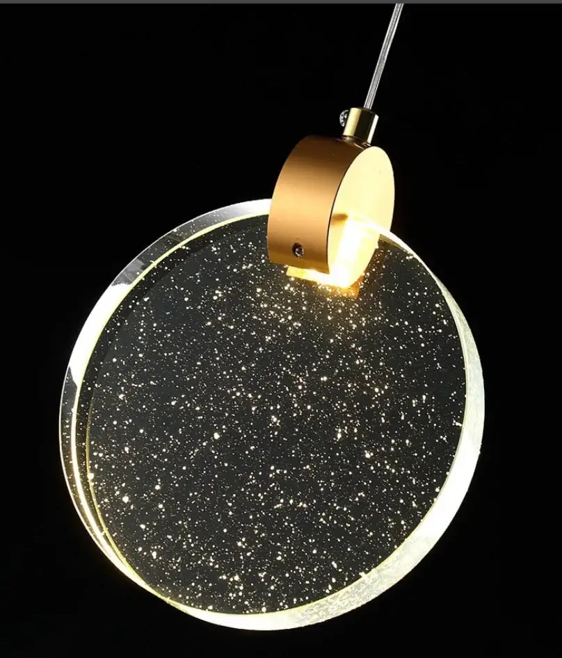 DecorBites™ led crystal pendant light with gold metal fixture and clear acrylic disc with white star specks for bedroom