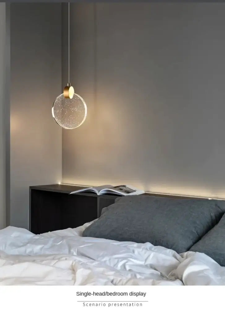 DecorBites™ led crystal pendant light with a clear spherical glass globe and gold chain for bedroom and bathroom use