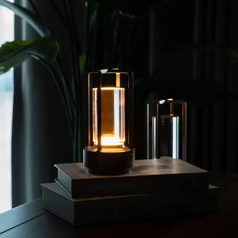 Decorbites™ led crystal table lamp with warm-toned glass and black metal frame emitting soft ambient light