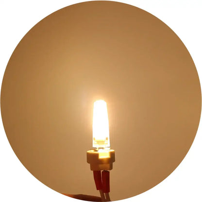Warm white led g4 bulb by decorbites with compact cylindrical glass body and metallic base halogen 25w replacement