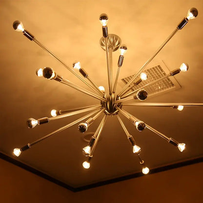 A sleek brushed brass starburst chandelier with polished metallic arms showcasing decorbites led g45 globe bulbs