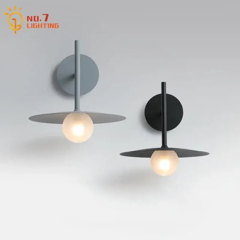 Minimalist decorbites led g9 wall lamp with matte gray and black finishes featuring circular backplates and warm bulbs
