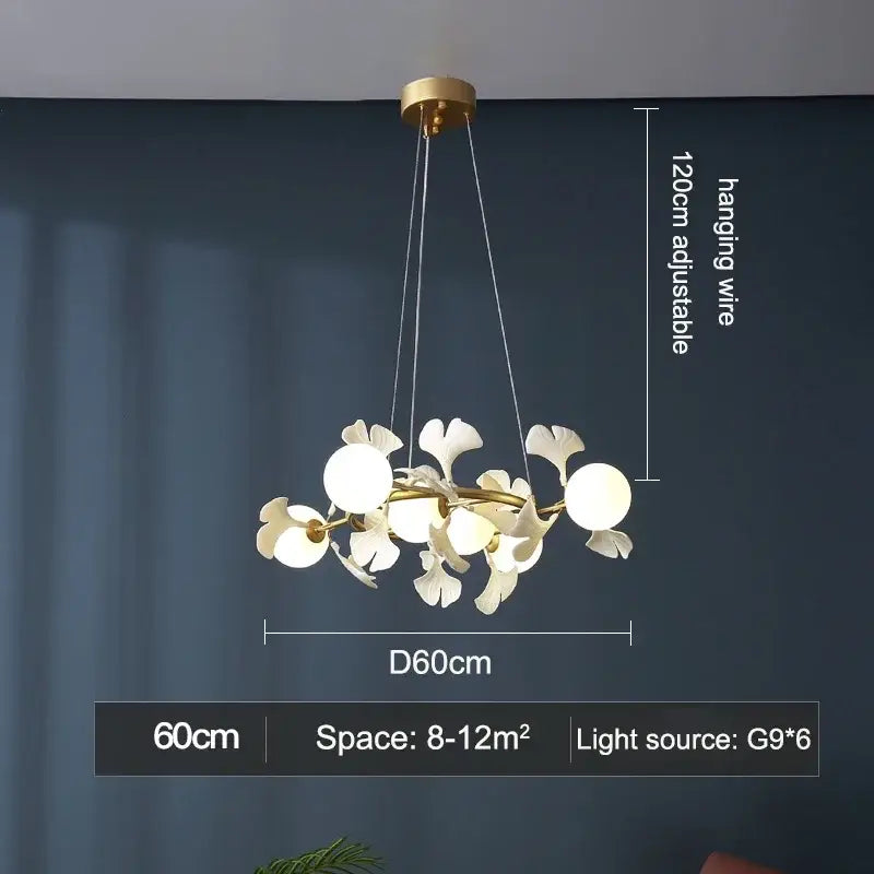 Gold-toned DecorBites LED Gingko ceiling chandelier with white leaf-shaped glass shades and spherical bulbs in a branching design
