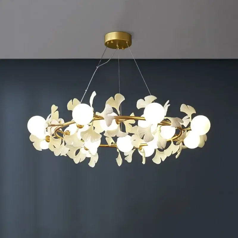 Gold-toned DecorBites LED Gingko ceiling chandelier with white petal-shaped glass shades in circular design for living room