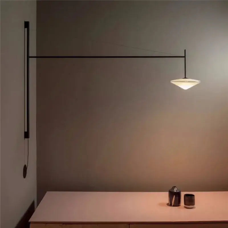 Minimalist black metal wall-mounted decorbites led glass art wall lamp with angular design and glowing white glass shade