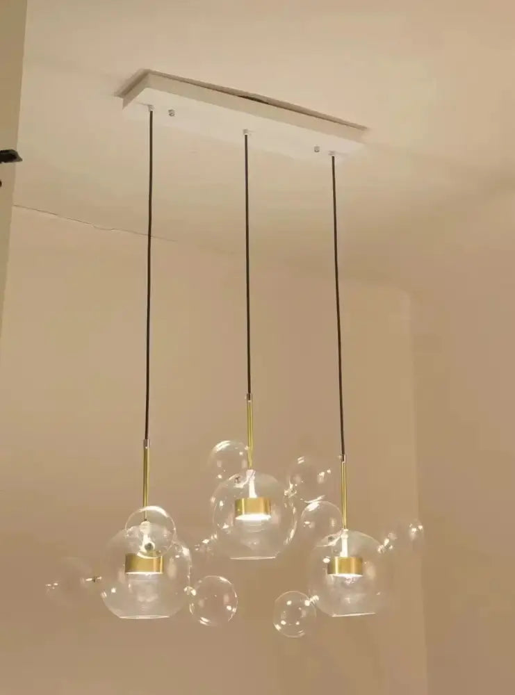 Modern decorbites led glass pendant lights with gold-toned metal accents and black cords for living and dining rooms