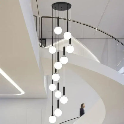 Modern black DecorBites LED glass ball chandelier with multiple white spherical LED glass balls for stylish indoor lighting