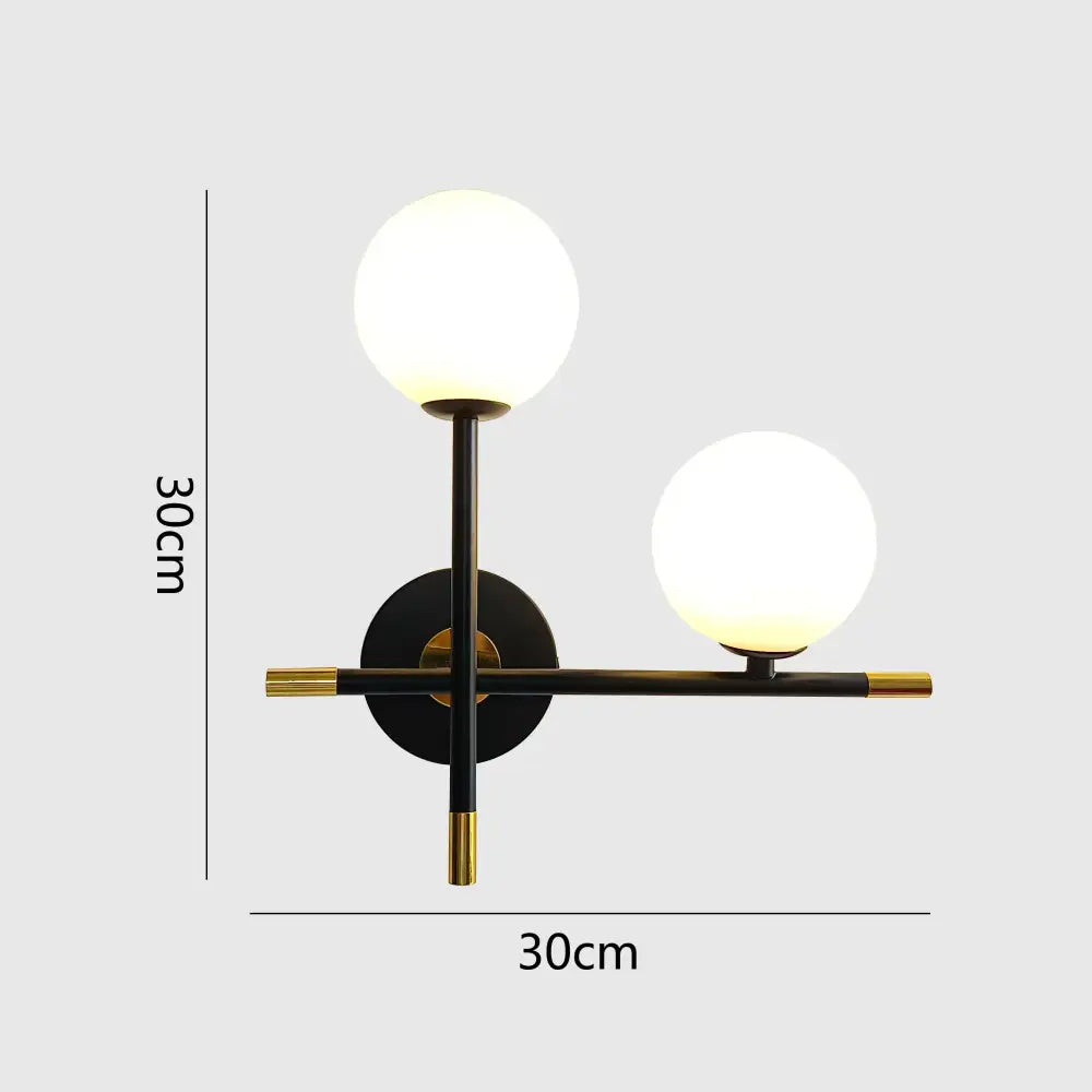 Modern black and brass decorbites led glass wall lamp with two glowing led glass ball shades for bedroom lighting