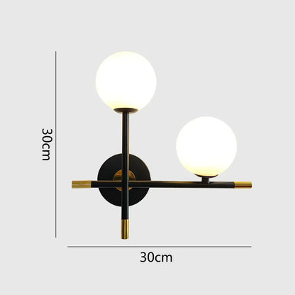 Modern black and brass decorbites led glass ball wall lamp with two glowing spherical shades for bedroom lighting
