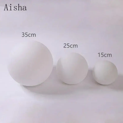 Three white matte led glass ball wall sconce lights by decorbites in sizes 15cm 25cm and 35cm