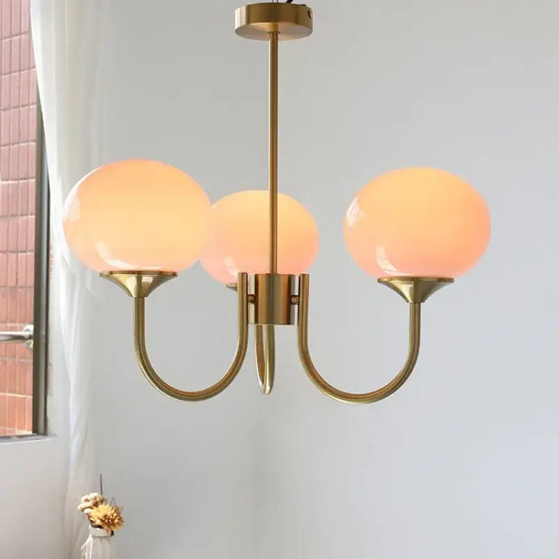 Brass-finished decorbites led glass balls chandeliers with warm translucent orange glass globes for home decor