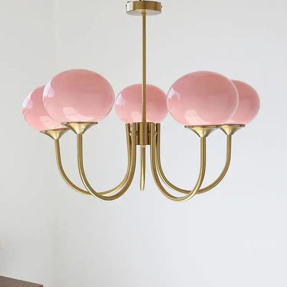 A delicate brass decorbites led glass chandelier with five translucent pink glass balls shades for home decor