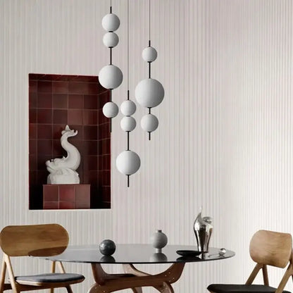 Modern white spherical decorbites led glass beads pendant chandelier with smooth matte finish and minimalist design