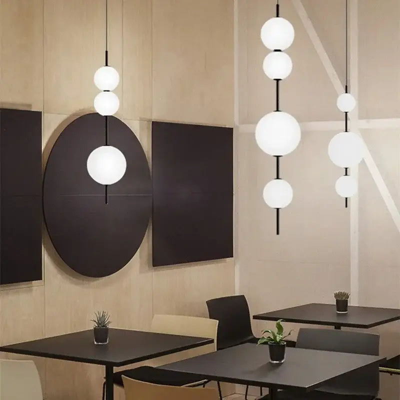 Modern white spherical decorbites led glass beads pendant chandelier with black rods hanging from ceiling