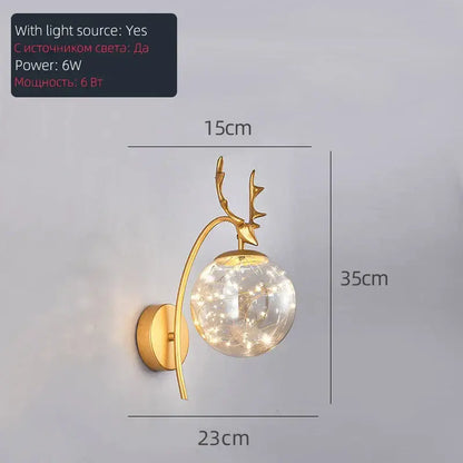 Gold-toned deer-head pendant light with spherical led glass bulb filled with glowing gypsophila string by decorbites led glass