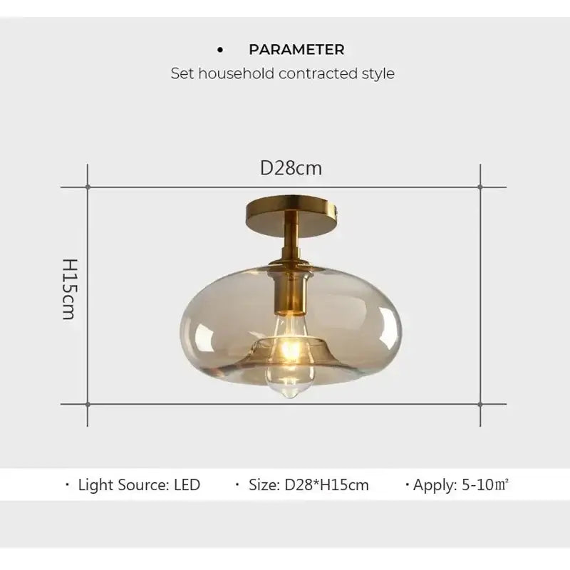 A modern frosted glass pendant ceiling light with brass fixture and exposed led bulb from decorbites led glass ceiling collection