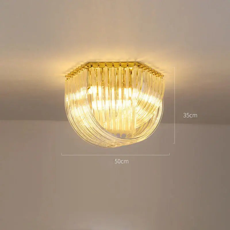 Golden-framed decorbites led glass chandelier with cascading clear glass rods for modern foyer lighting