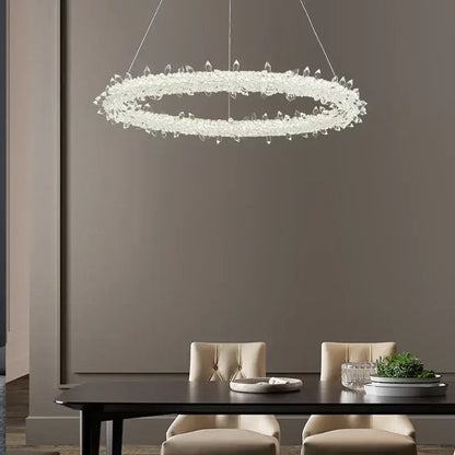 A decorbites led glass crystal chandelier featuring a modern circular ring design with clear crystal droplets in white lustre