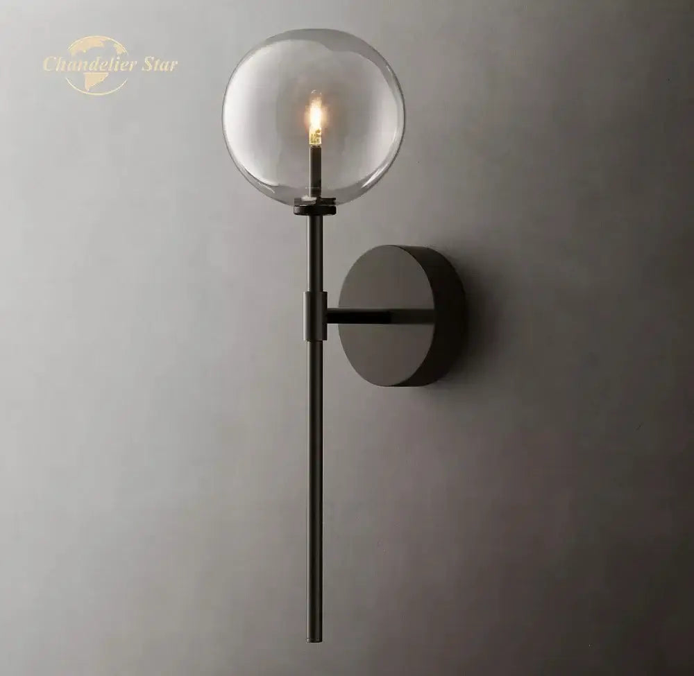 Modern black metal wall sconce with glass globe and exposed filament bulb for indoor decorbites led glass lighting