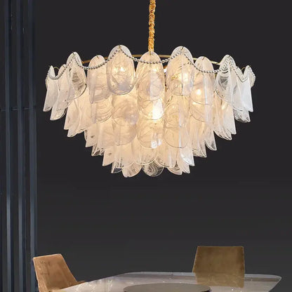 Decorbites led glass pendant light featuring a translucent layered scalloped glass shell with gold-toned chain suspension