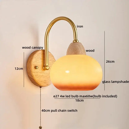 DecorBites™ modern nordic wall light fixture with warm-toned glass shade brass iron arm and wooden canopy for bedside use