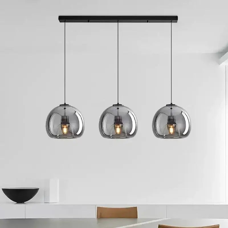 Modern nordic luxury decorbites led glass pendant light with black metal bar and smoked glass shades encasing warm bulbs
