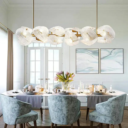 Gold-toned decorbites led glass petal chandeliers with crystal-encrusted spherical fixtures for modern dining table lighting
