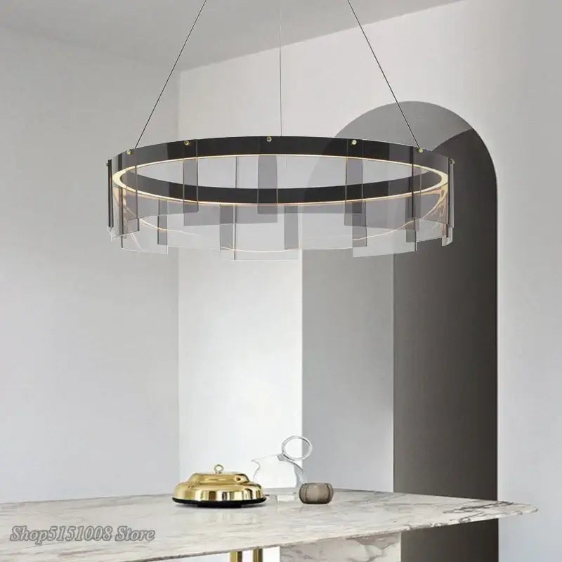 Modern circular DecorBites LED glass ring pendant lights with a sleek black iron frame and warm LED lighting for home décor