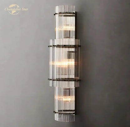 Modern decorbites led glass san marco wall lamp featuring stacked clear glass rods with dark metal bands emitting warm glow