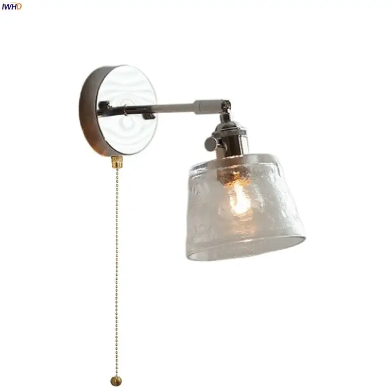 A vintage-style decorbites led glass wall light with frosted textured shade and brushed nickel finish for bedside use