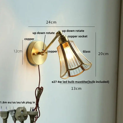 Brass-finished adjustable wall light fixture with fluted glass shade and copper socket for modern living room or bar use