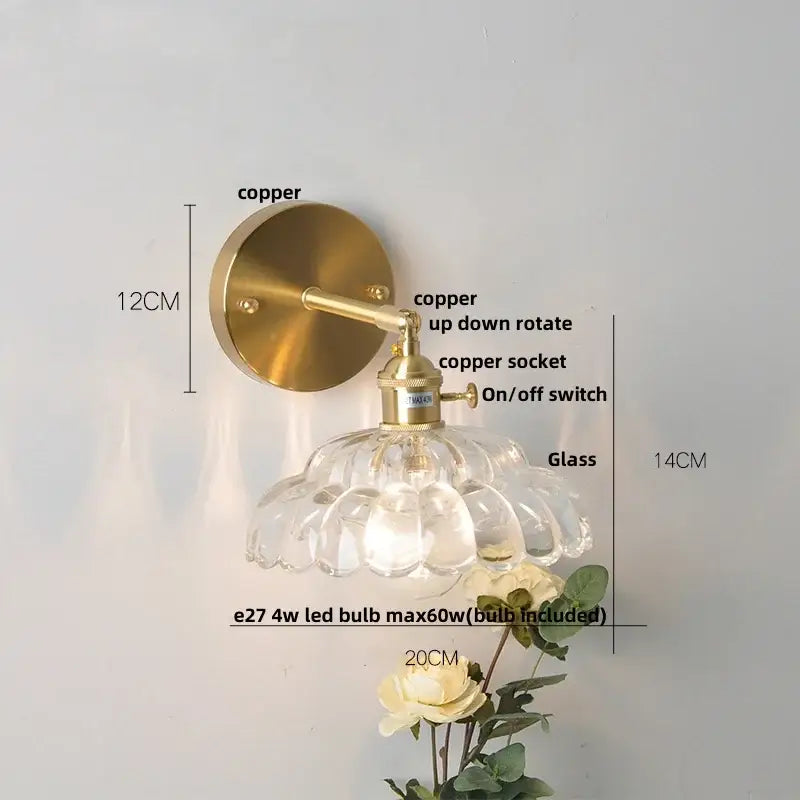 Vintage-style decorbites led glass wall light with brass-finished copper mount and scalloped glass shade for bedside use