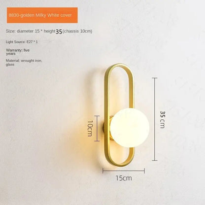 Gold-toned wrought iron decorbites™ led wall sconce lamp with milky white glass diffuser for bedroom and living room