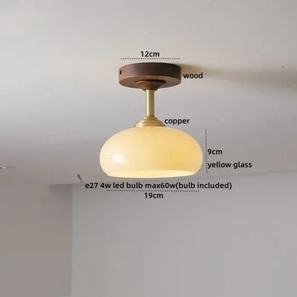 A decorbites led glass wood ceiling lamp with a warm yellow glass shade copper stem and wooden mount for modern indoor lighting