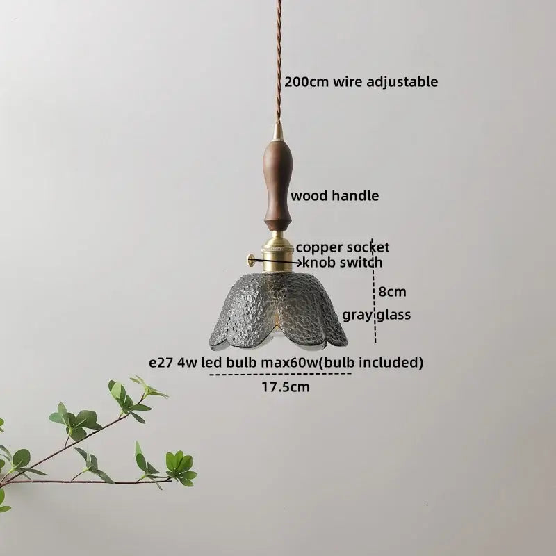 A delicate gray glass wood pendant light with a textured petal design and wooden handle for modern home décor
