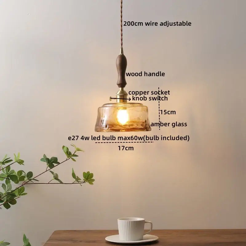 A warm amber led glass wood pendant light with wooden handle copper socket and adjustable 200cm wire by DecorBites