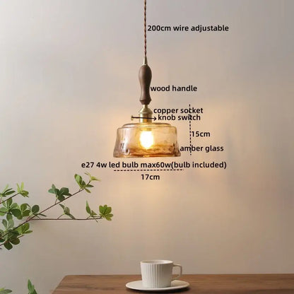 A warm amber led glass wood pendant light with wooden handle copper socket and adjustable 200cm wire by DecorBites