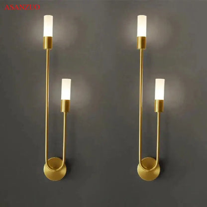 Gold-toned decorbites led candlestick wall light with minimalist curved metal arms and frosted glass bulbs for indoor decor