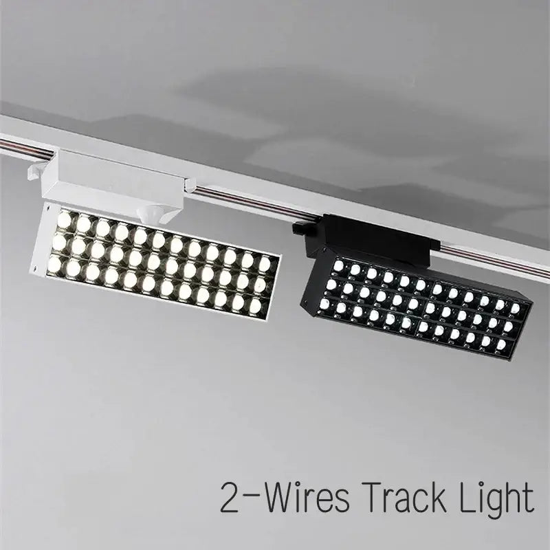 Two rectangular decorbites led grille track lights in white and black with bright circular bulbs for clothing store lighting