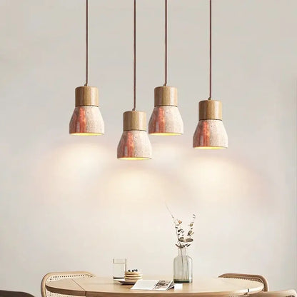 Four decorbites led hanging lamps with wooden tops and yellow travertine speckled concrete shades for living spaces