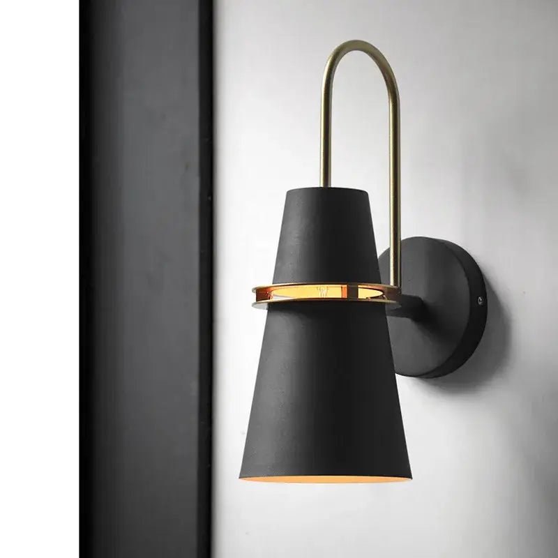 Black matte decorbites led horn wall lamp with brass arch and warm light for modern home decor