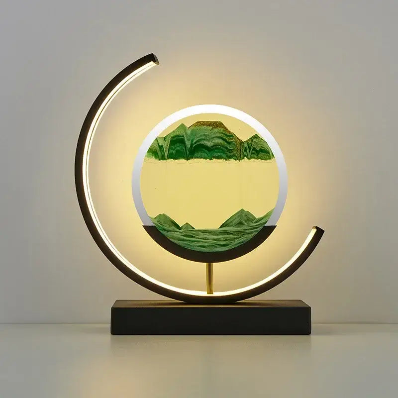 Modern crescent-shaped decorbites led hourglass lamp with glowing frame and layered green sand mountains on yellow backdrop