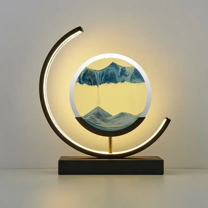 Modern crescent-shaped decorbites led hourglass quicksand desk lamp with glowing frame and blue beige sand art mountains