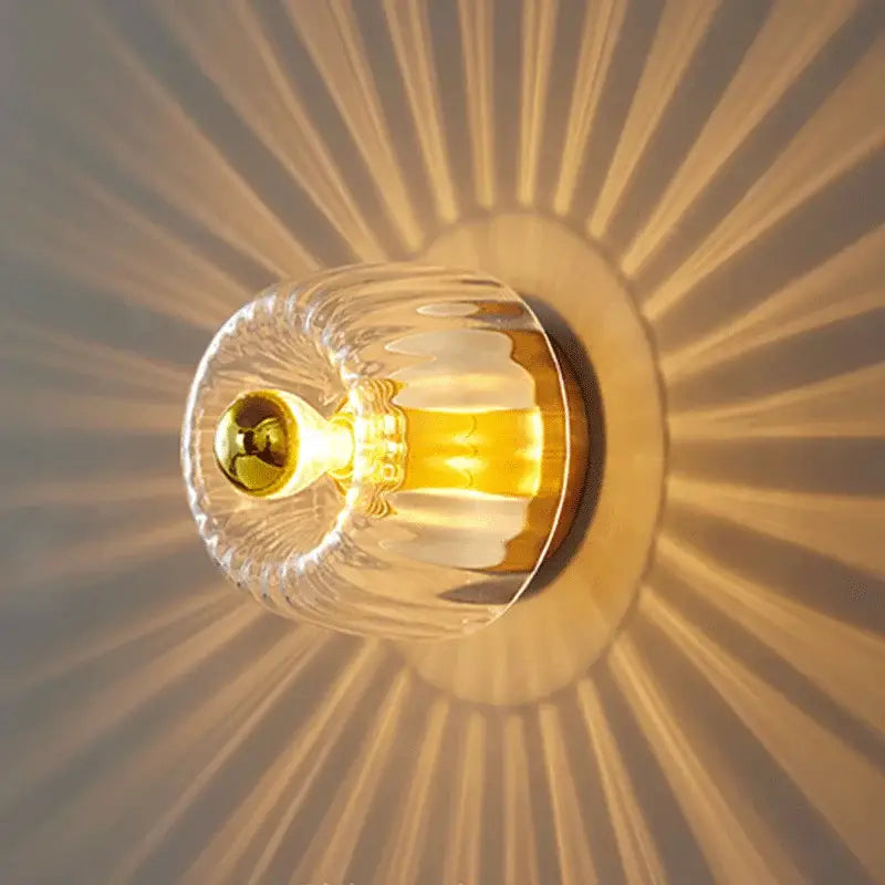 DecorBites led indoor glass wall sconce with clear faceted glass and gold-toned metal base for living room use