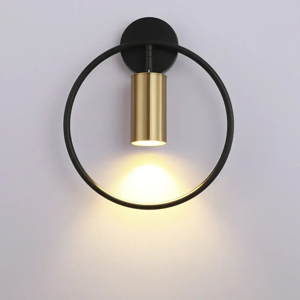 Modern black and gold circular wall lamp with sleek minimalist design from DecorBites led indoor wall lighting collection