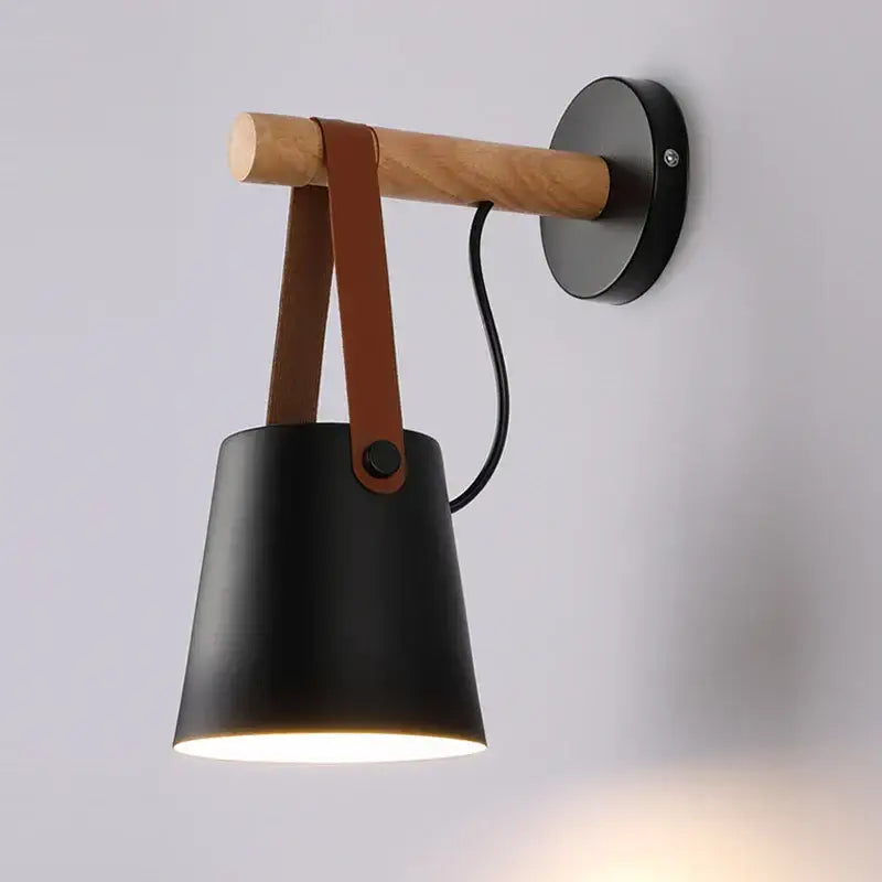 Black matte wall lamp with natural wood arm and brown leather strap in decorbites led indoor wall lighting series