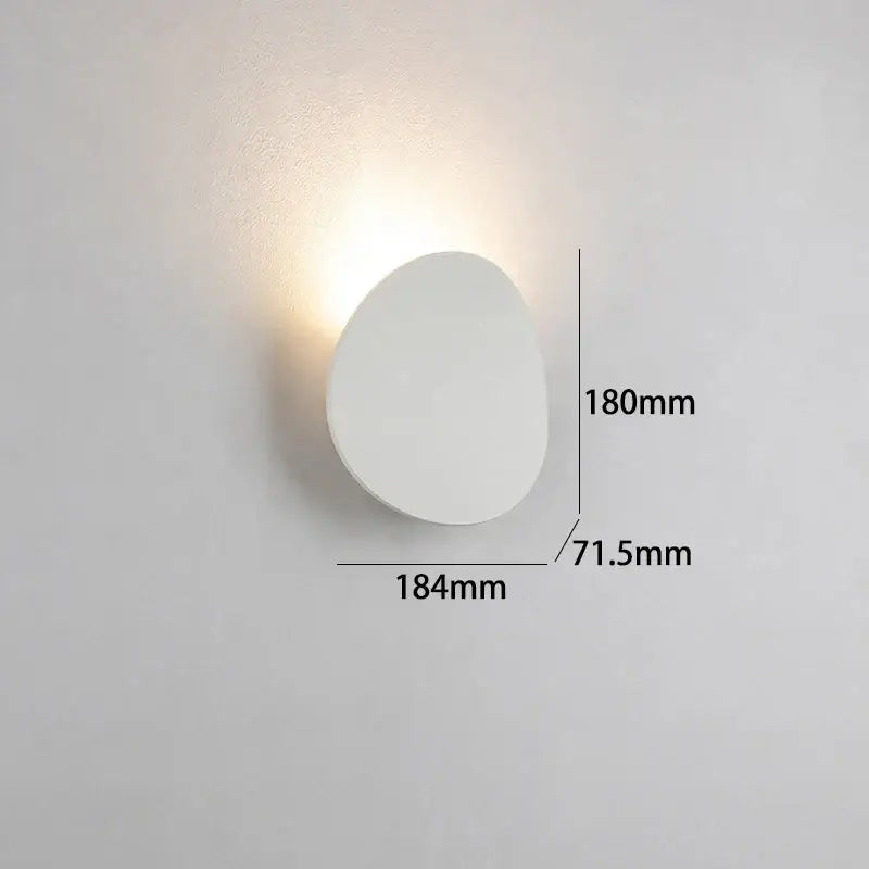 Minimalist white decorbites led indoor wall lamp with smooth oval shape and soft ambient glow for living room lighting
